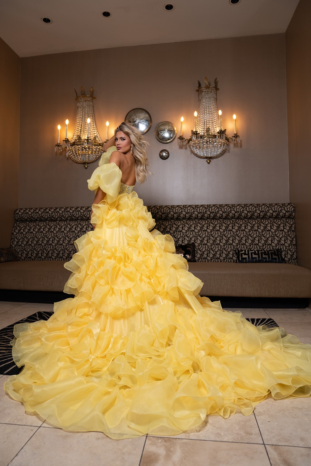 Yellow pageant gown with sweetheart neckline, dramatic overskirt, and intricate crystal beading
