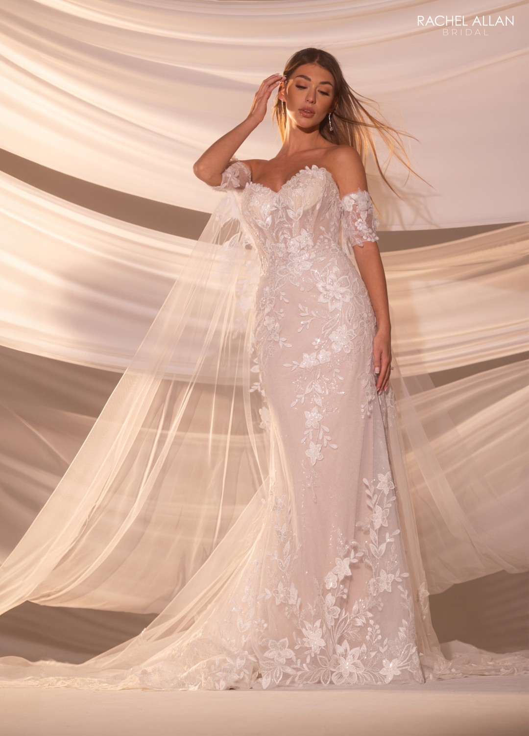•	Lo' Adoro Style RB5101 fit and flare wedding dress with glitter tulle, lace appliqué, off-shoulder floral sleeves and detachable cape