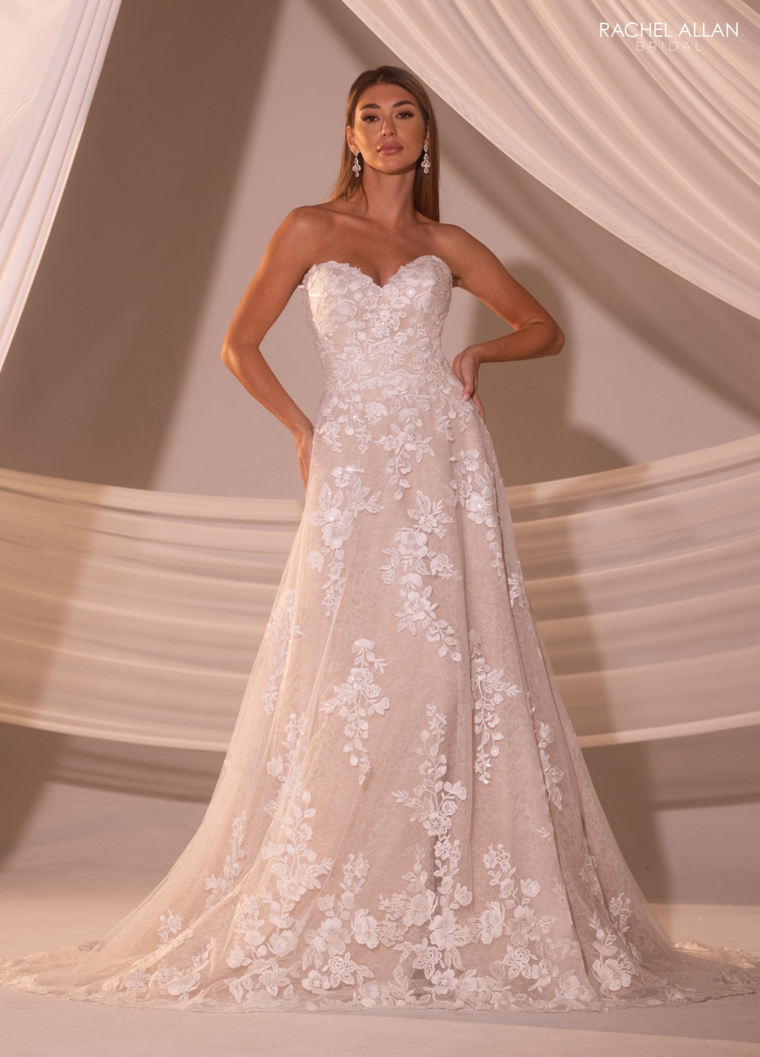 Rachel Allan Style RB4219 sweetheart A-line bridal dress with lace overlay, floral appliqué, and intricate beading over tulle layers