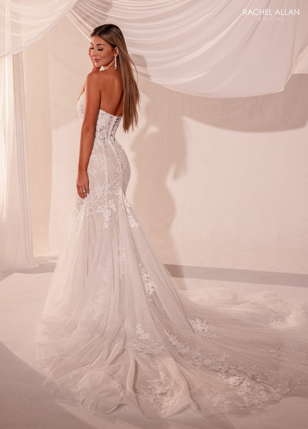 •	RB5105: "Rachel Allan ivory sand mermaid wedding dress with intricate lace detailing from Lo'Adoro Bridal Collection"